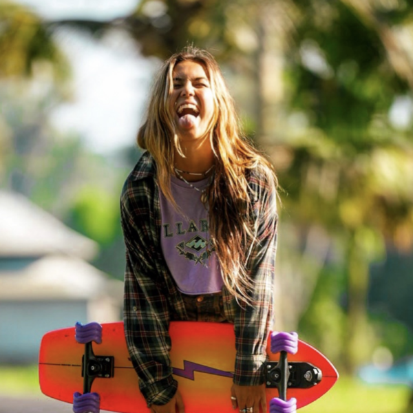 Girl with skateboard with shark wheel